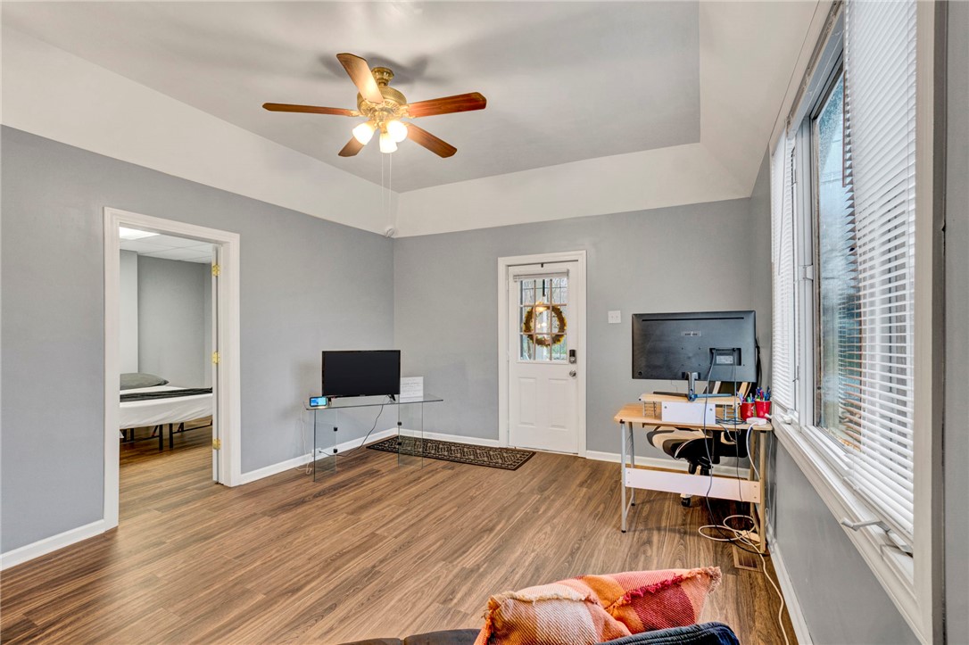 2505 East Brown Street Seneca, SC 29678 - Photo 11 of 43 This living area features a clean design with rich flooring and bright natural light.