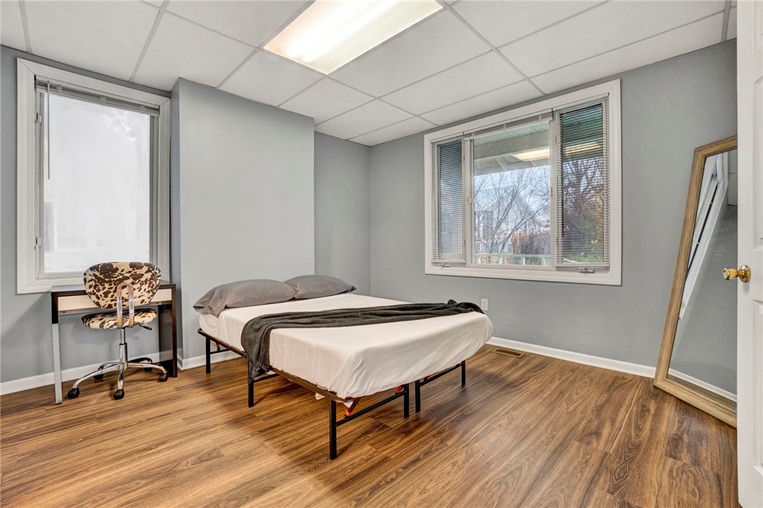 2505 East Brown Street Seneca, SC 29678 - Photo 14 of 43 This cozy bedroom features durable laminate flooring and ample natural light from two large windows.