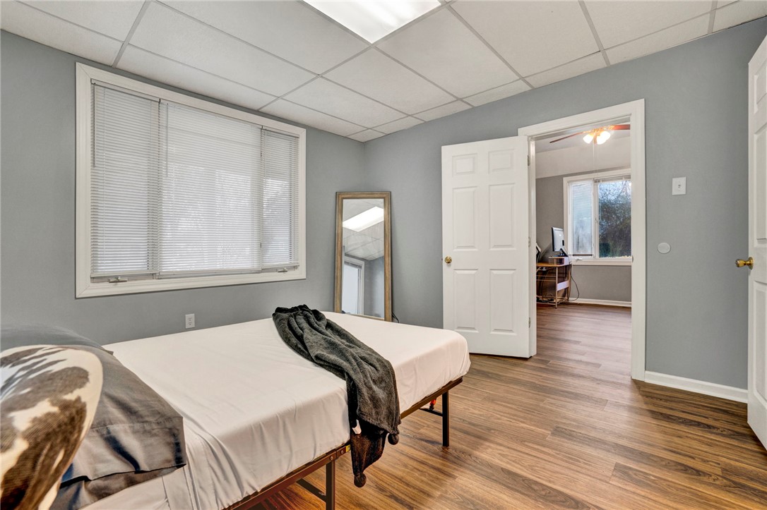 2505 East Brown Street Seneca, SC 29678 - Photo 15 of 43 This spacious bedroom features ample natural light and durable wood flooring.