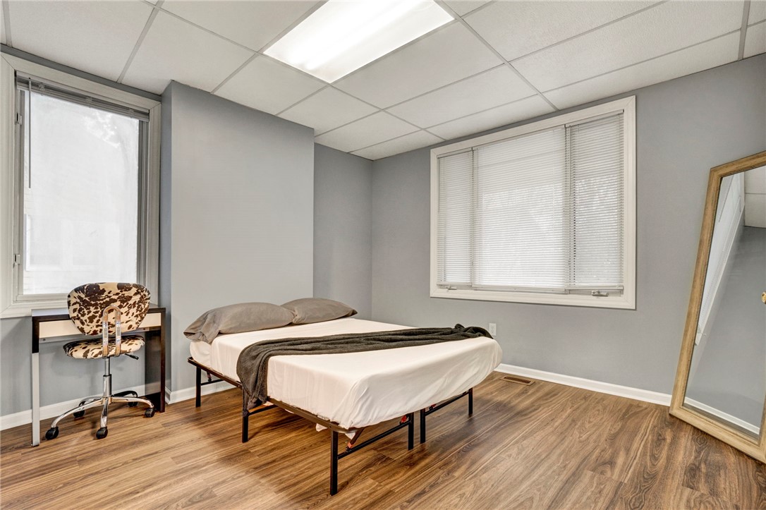 2505 East Brown Street Seneca, SC 29678 - Photo 21 of 43 This cozy bedroom features durable wood flooring and ample natural light, perfect for relaxation.