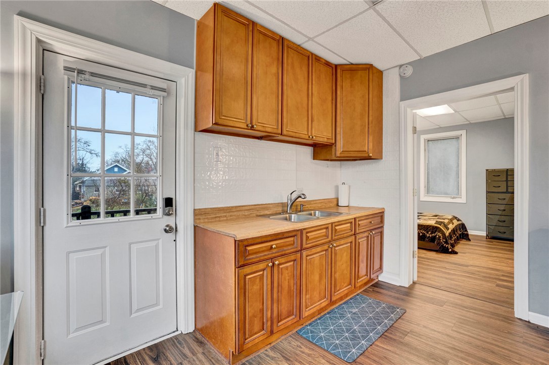 2505 East Brown Street Seneca, SC 29678 - Photo 29 of 43 This cozy kitchen area offers essential amenities, connecting seamlessly to a comfortable living space.
