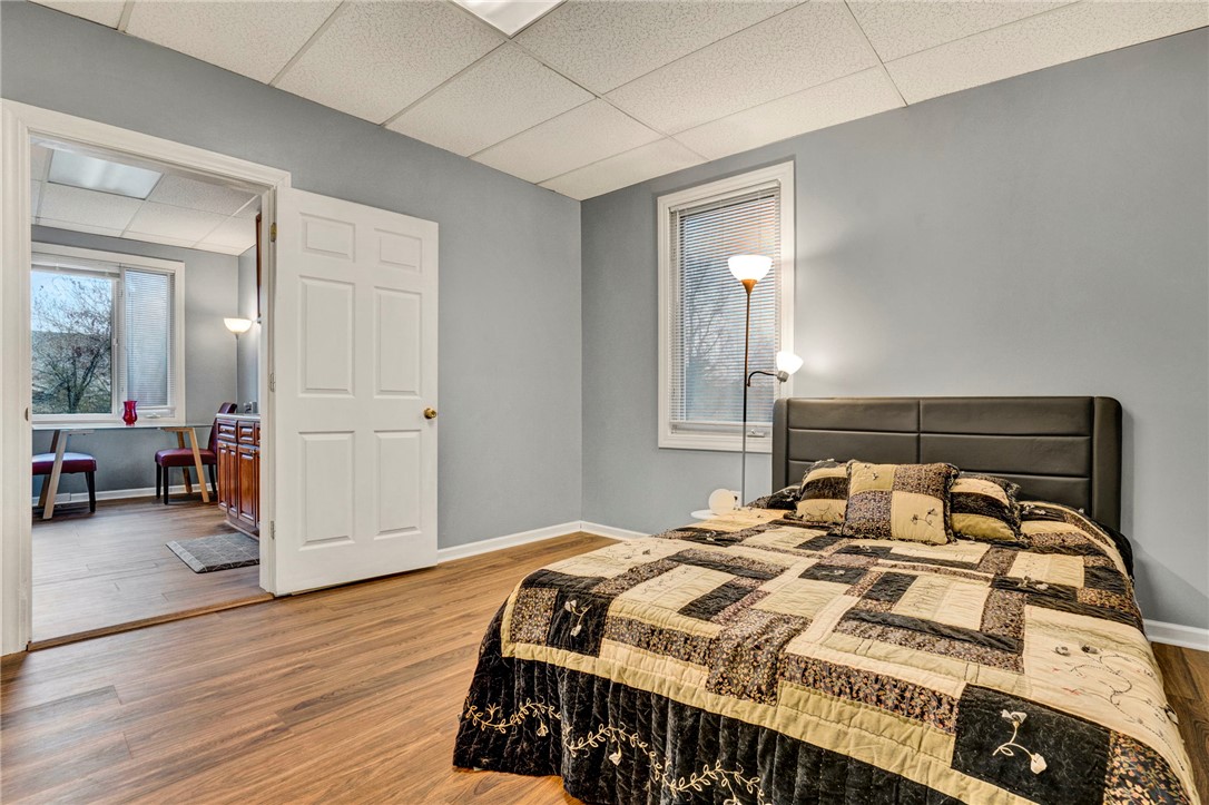 2505 East Brown Street Seneca, SC 29678 - Photo 32 of 43 This cozy bedroom features durable flooring and a window with blinds, creating a comfortable living space.