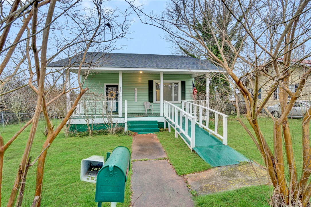 2505 East Brown Street Seneca, SC 29678 - Photo 4 of 43 This charming home offers a welcoming facade with a convenient accessibility ramp.