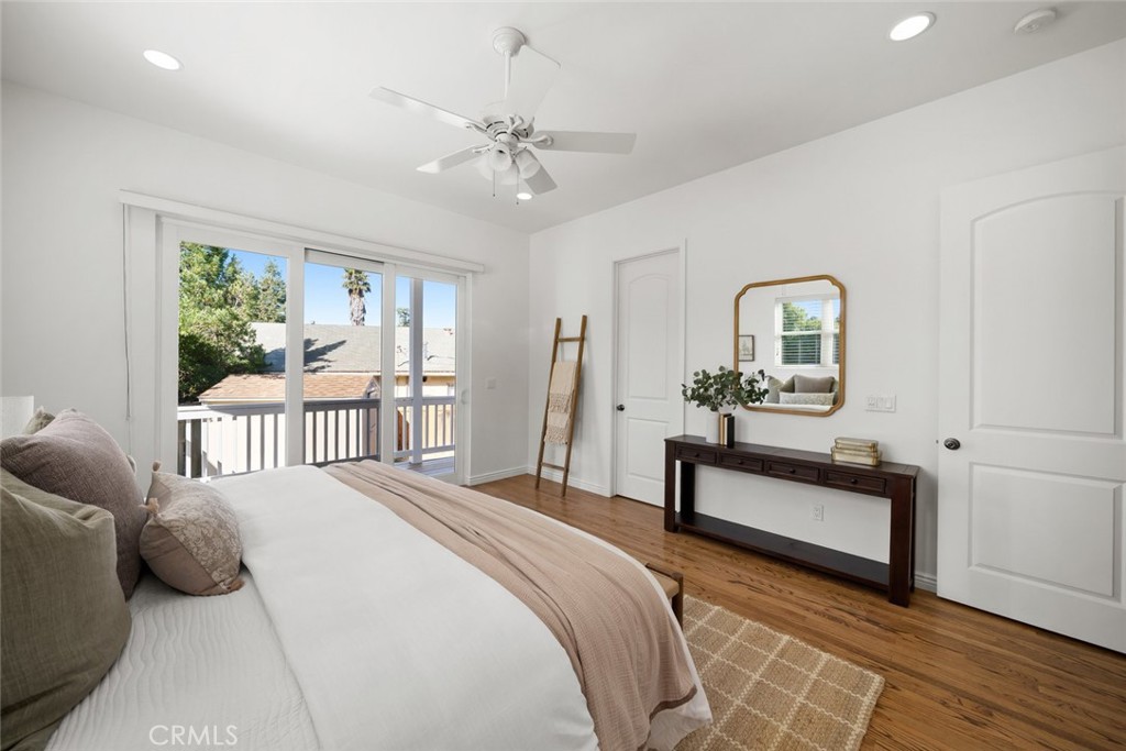 2265 Broad Street San Luis Obispo, CA 93401 - Photo 12 of 39 a bedroom with a bed a chandelier and large window