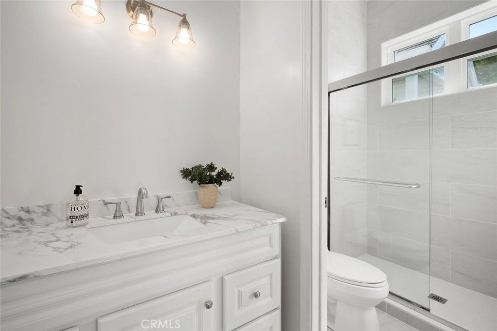 2265 Broad Street San Luis Obispo, CA 93401 - Photo 19 of 39 a bathroom with a sink and toilet