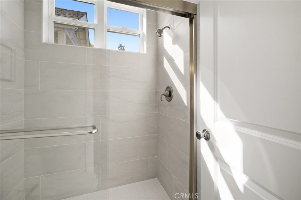 2265 Broad Street San Luis Obispo, CA 93401 - Photo 20 of 39 a bathroom with a glass shower door