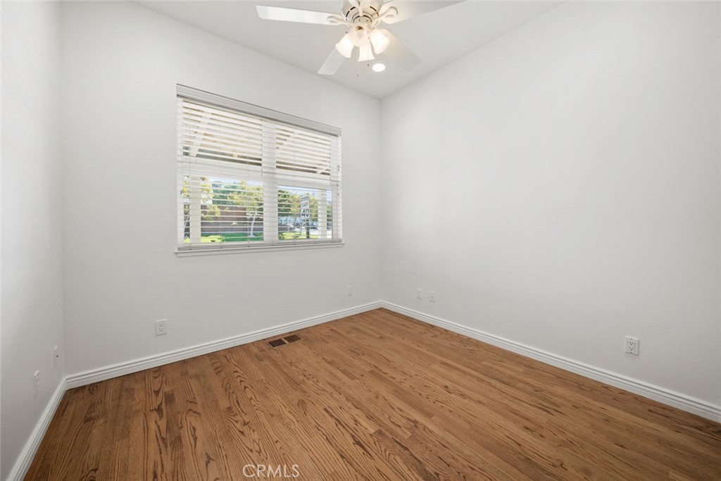 2265 Broad Street San Luis Obispo, CA 93401 - Photo 31 of 39 an empty room with wooden floor and windows