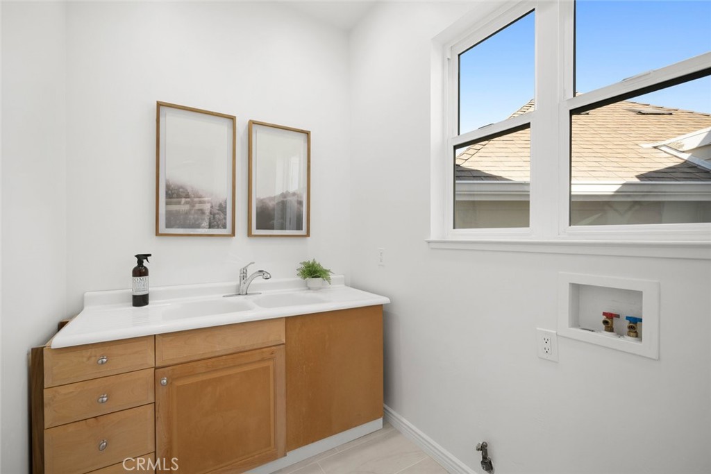 2265 Broad Street San Luis Obispo, CA 93401 - Photo 34 of 39 a bathroom with a sink and a mirror
