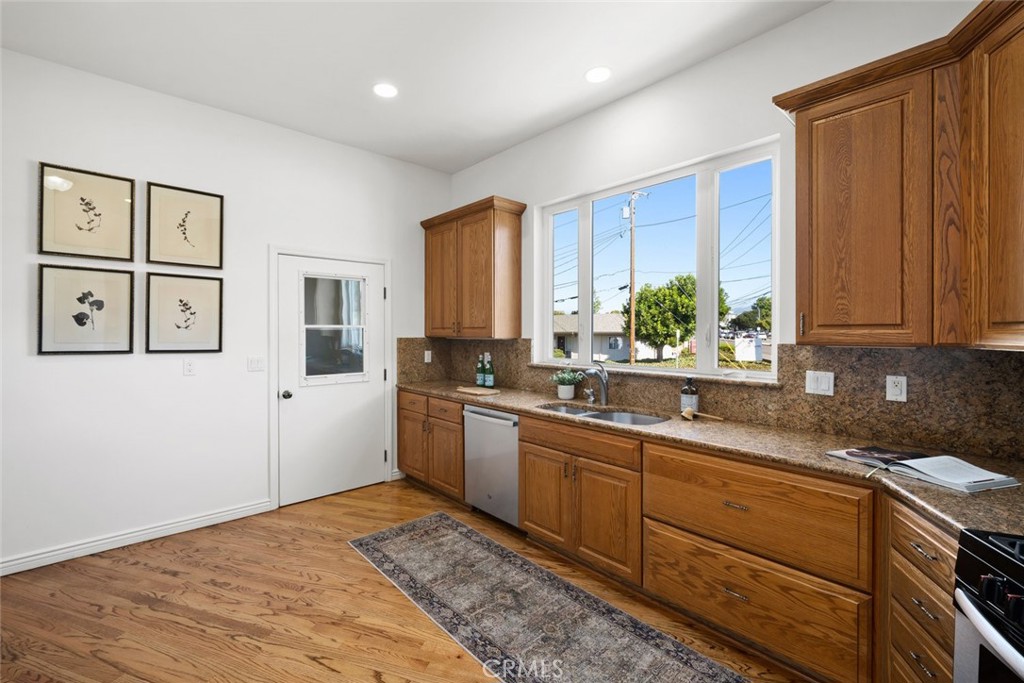 2265 Broad Street San Luis Obispo, CA 93401 - Photo 5 of 39 a kitchen with stainless steel appliances granite countertop a sink stove and cabinets