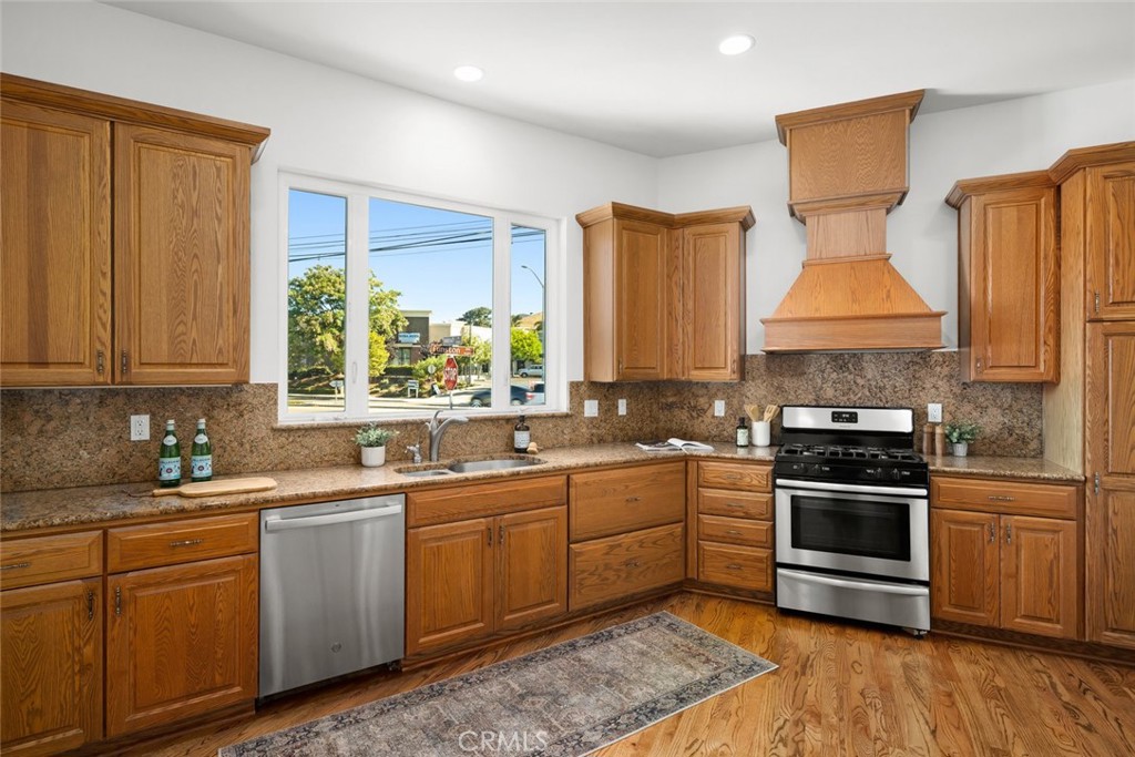 2265 Broad Street San Luis Obispo, CA 93401 - Photo 7 of 39 a kitchen with a sink stove and cabinets