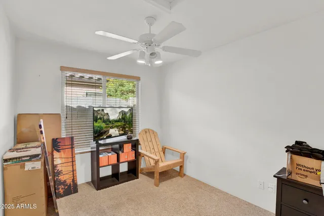 a bedroom with a bed and a lamp