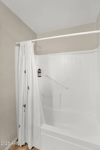 a bathroom with a sink vanity mirror and toilet
