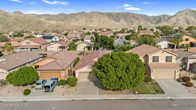 an aerial view of houses with yard