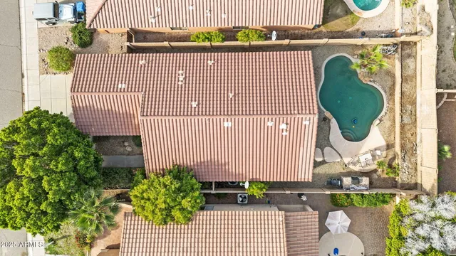 an aerial view of residential houses with outdoor space