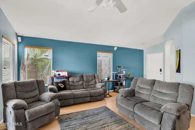 a living room with furniture and a large window
