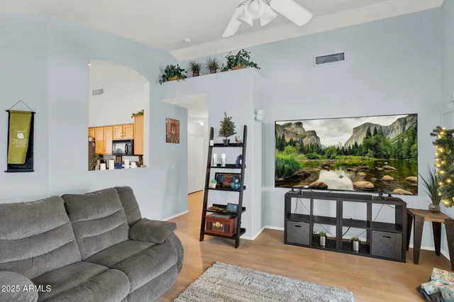 a living room with furniture and a large window