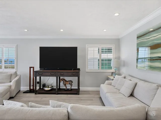 a kitchen with a sink cabinets and stainless steel appliances