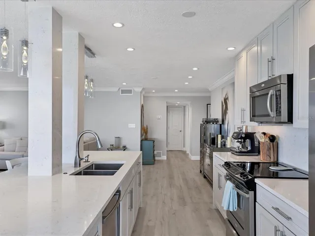 a bathroom with a granite countertop sink a shower and a mirror