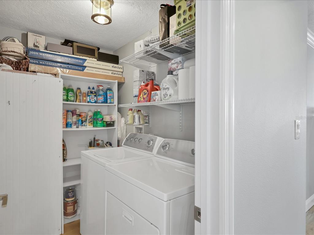 226 Golden Gate Point, Unit 44 Sarasota, FL 34236 - Photo 43 of 65 a utility room with dryer and washer