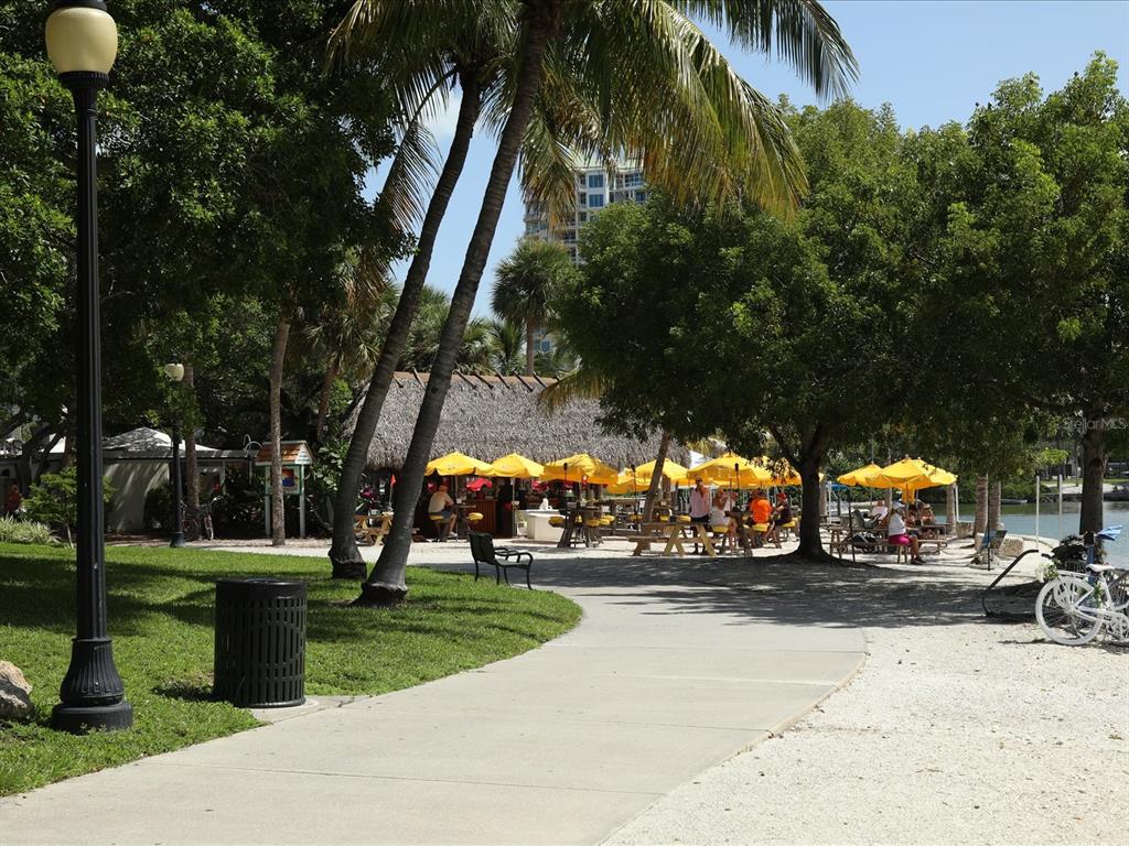226 Golden Gate Point, Unit 44 Sarasota, FL 34236 - Photo 61 of 65 a view of street with parked cars