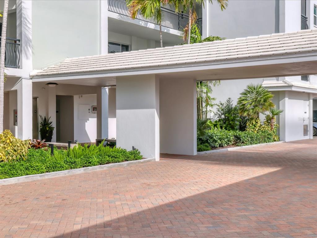 226 Golden Gate Point, Unit 44 Sarasota, FL 34236 - Photo 8 of 65 front view of a house with a yard