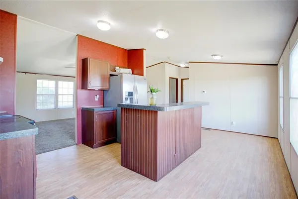 a view of a kitchen cabinets and wooden floor
