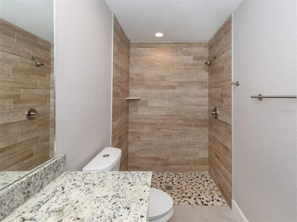 a bathroom with a sink and a shower