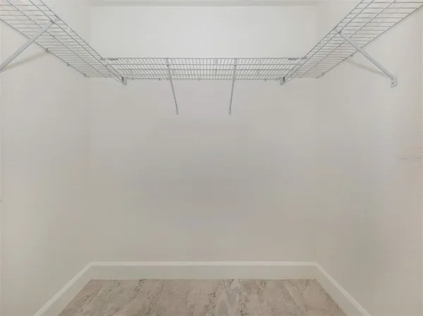 a view of a room with racks on the wall