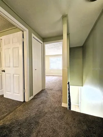 a view of an empty room and window
