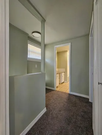 a view of an empty room and window