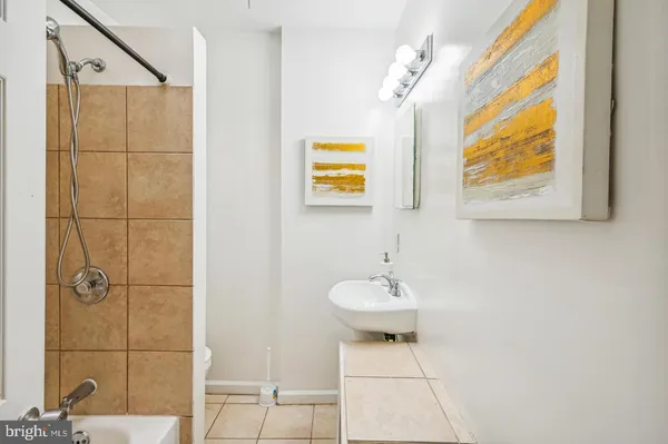 a view of a bathroom with a sink and a mirror