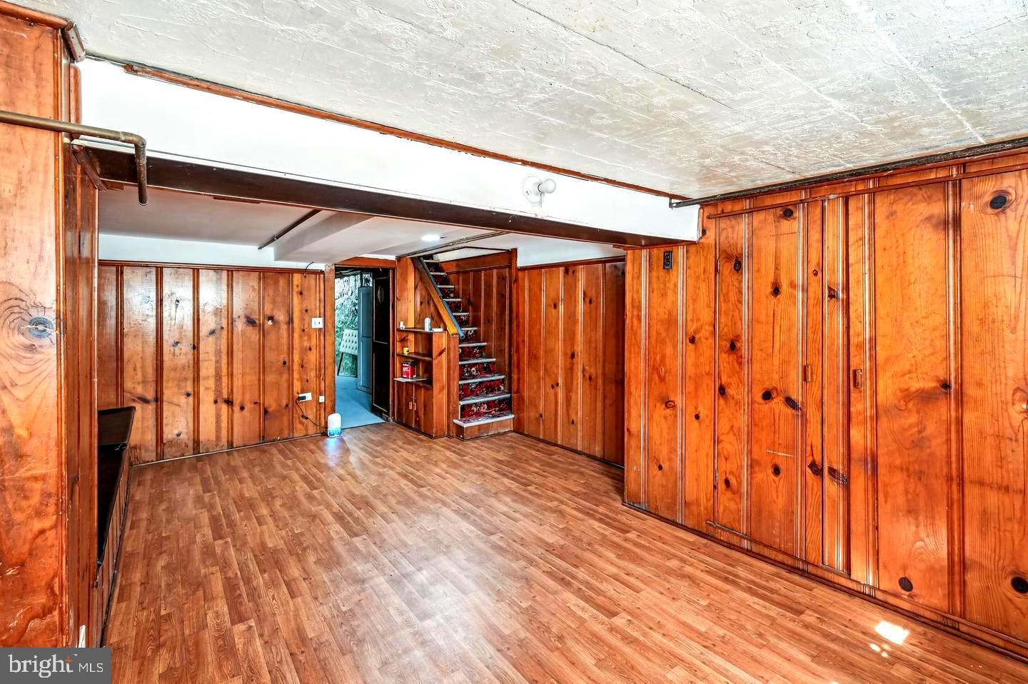 5632 Belair Road Baltimore, MD 21206 - Photo 26 of 32 a view of an empty room with wooden floor