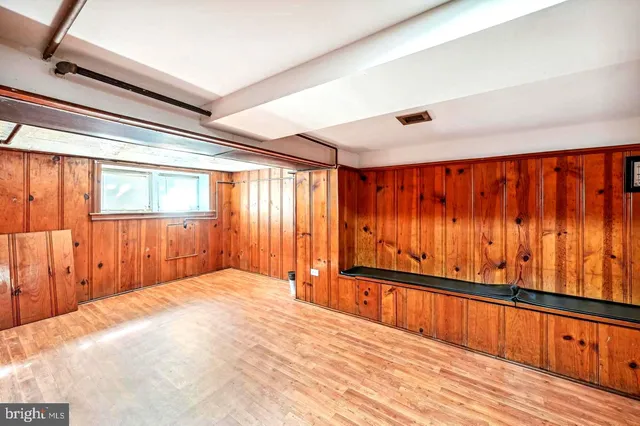 a view of an empty room and wooden floor