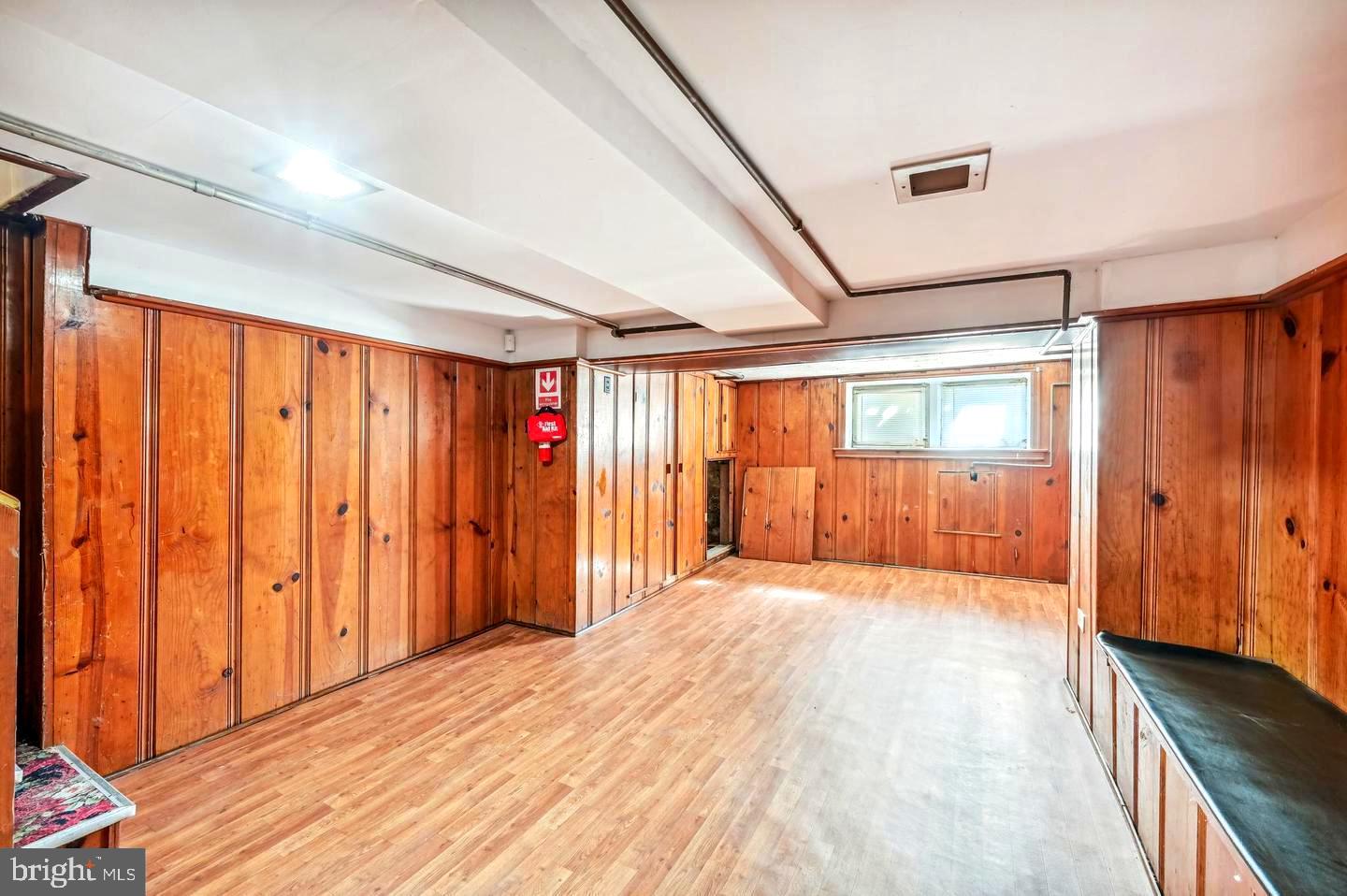 5632 Belair Road Baltimore, MD 21206 - Photo 31 of 32 a view of an empty room and wooden floor