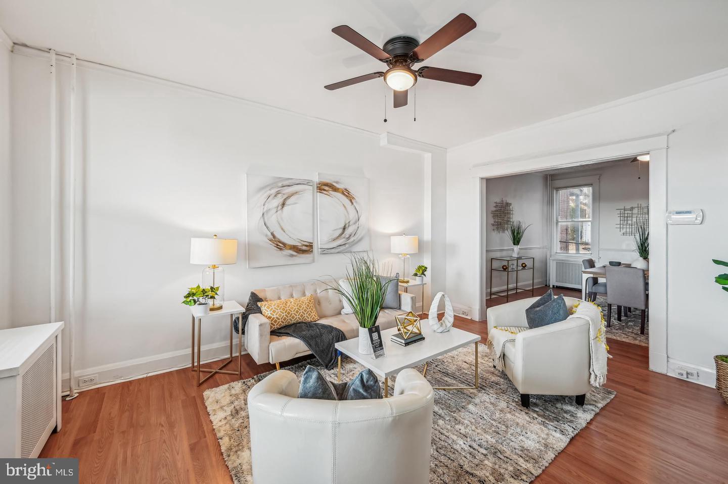 5632 Belair Road Baltimore, MD 21206 - Photo 9 of 32 a living room with furniture and a wooden floor