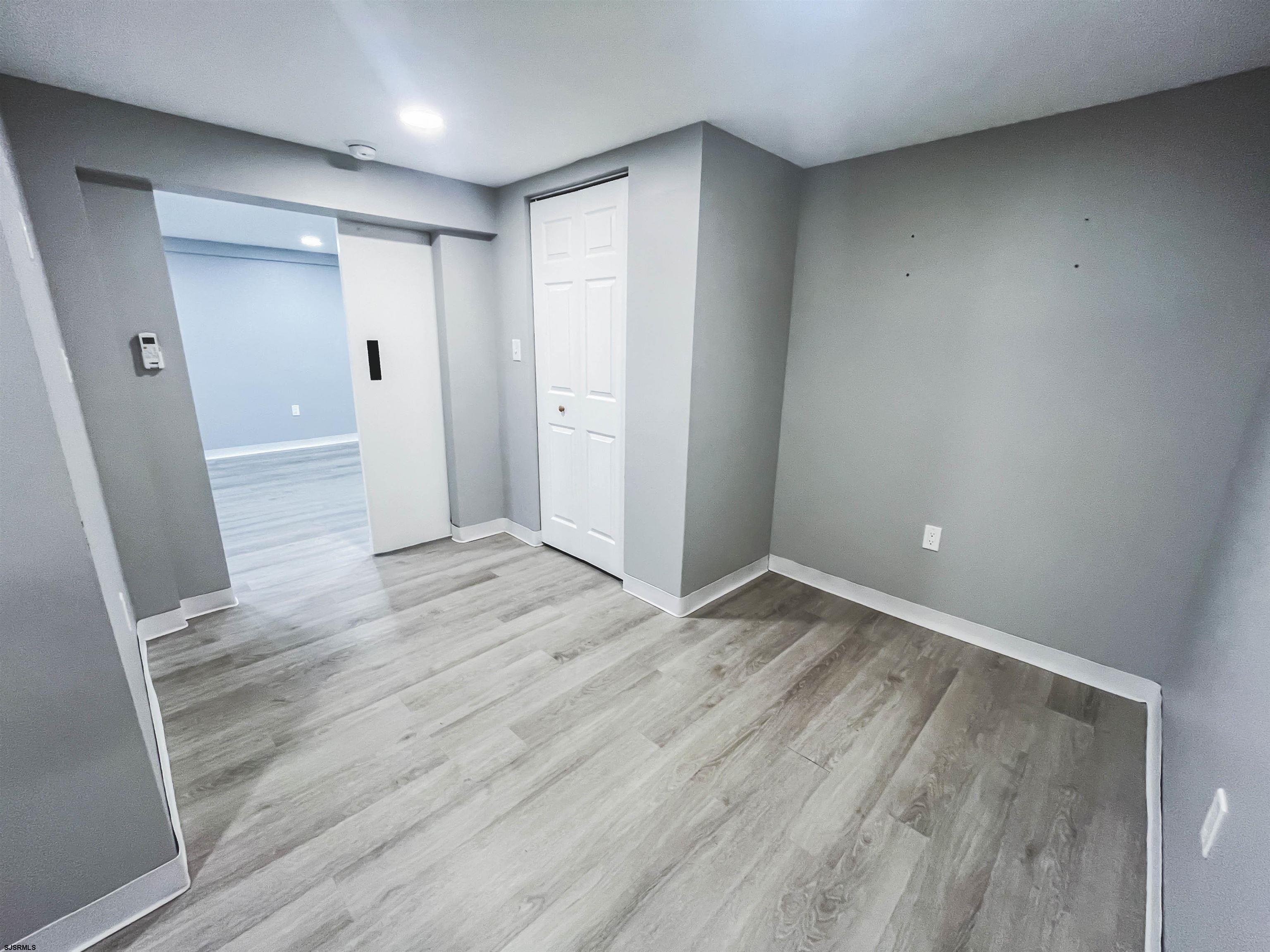 518 Delaware Avenue Absecon, NJ 08201 - Photo 28 of 38 wooden floor in an empty room