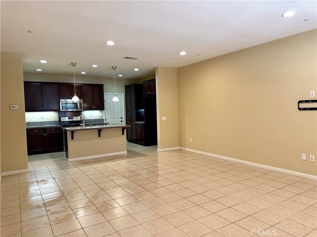 467 Raya Lane Brea, CA 92823 - Photo 6 of 30 a kitchen with stainless steel appliances granite countertop a refrigerator and a sink