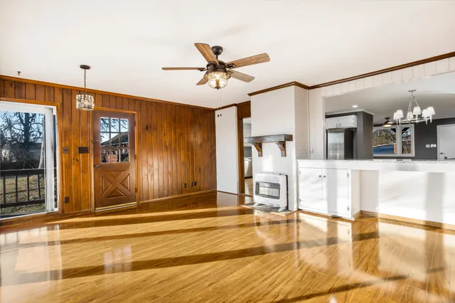 a view of a livingroom with furniture & cabinet area