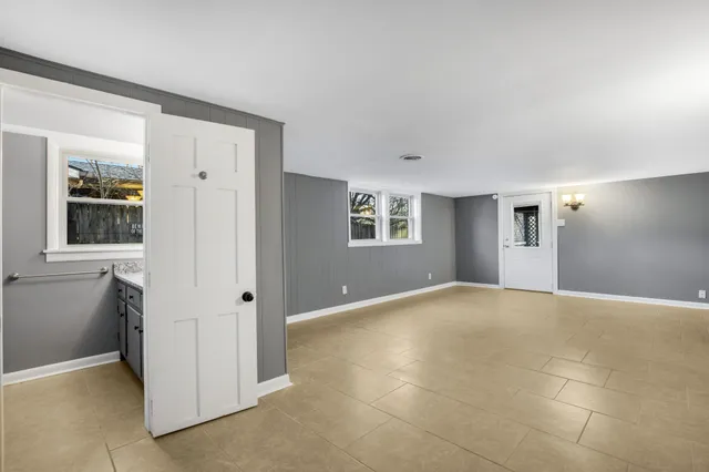a view of a big room with windows and cabinet