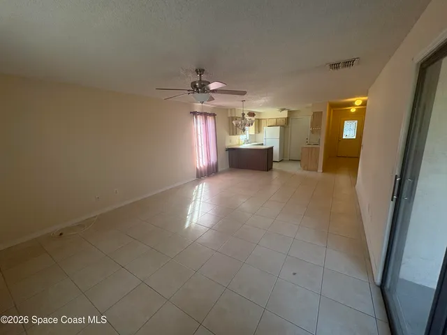 a view of a hallway with a chandelier