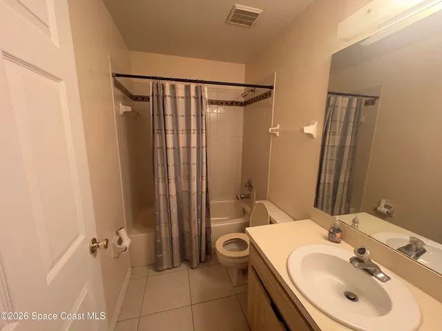 a bathroom with a sink a mirror and a shower