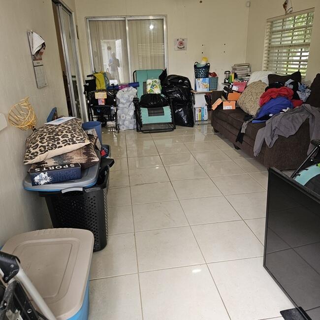 7202 Northwest 73rd Street Tamarac, FL 33321 - Photo 11 of 11 a living room with furniture a window and a fireplace