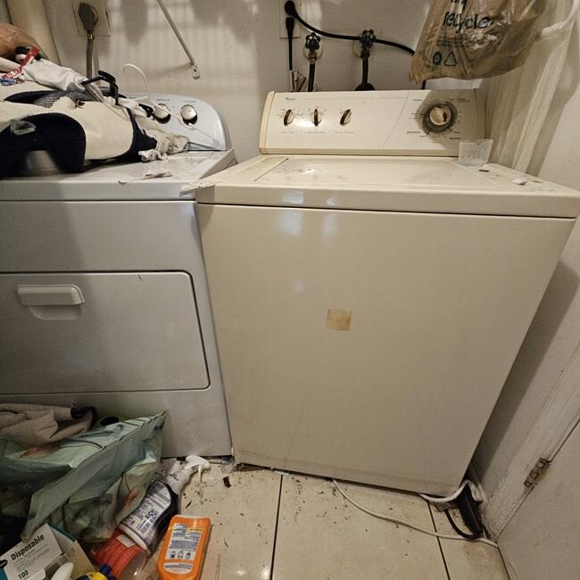 7202 Northwest 73rd Street Tamarac, FL 33321 - Photo 9 of 11 a utility room with dryer and washer