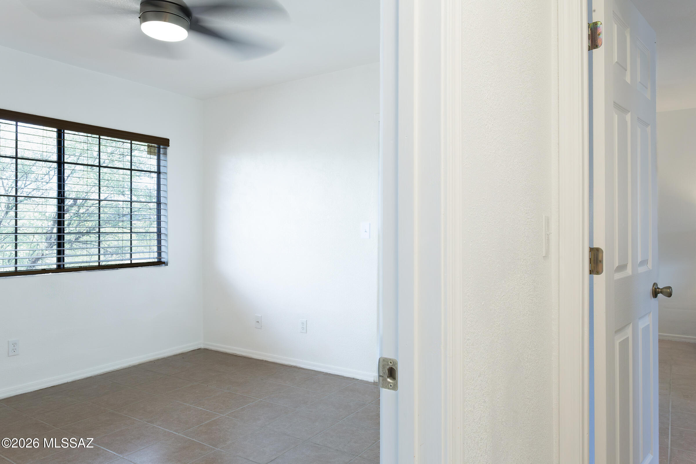 1081 Paseo Freno Rio Rico, AZ 85648 - Photo 16 of 46 a view of an empty room with a window