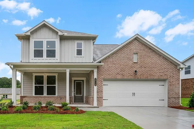 a view of front a house with a yard