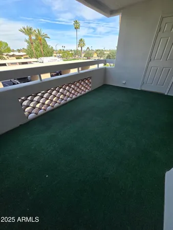 a view of a porch with furniture and a window