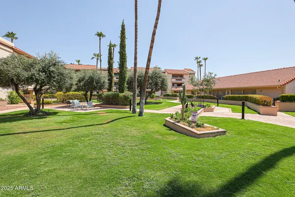 a view of a patio with a table chairs and a patio