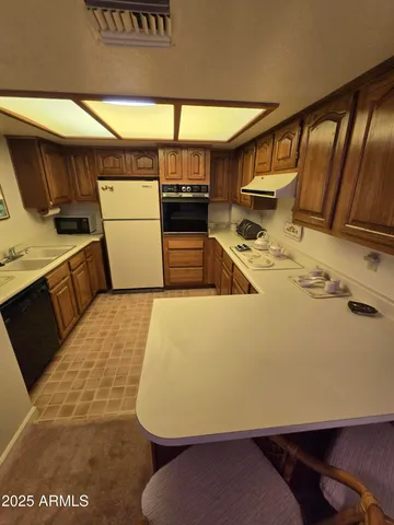 a view of a kitchen with a sink