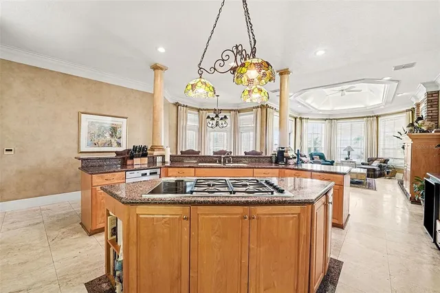 a kitchen with stainless steel appliances a refrigerator sink and cabinets