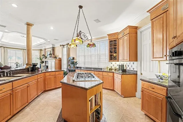 a spacious bedroom with a bed and a flat screen television